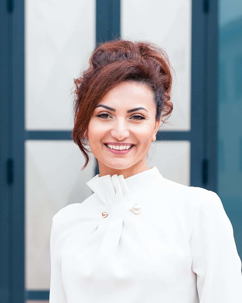 a person standing in front of a mirror posing for the camera