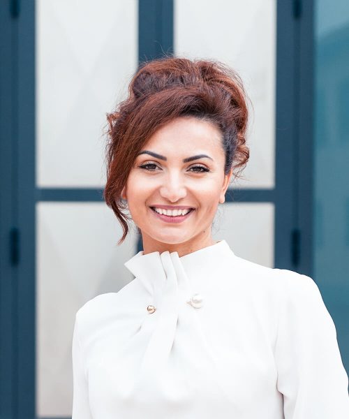 A Person Standing In Front Of A Mirror Posing For The Camera