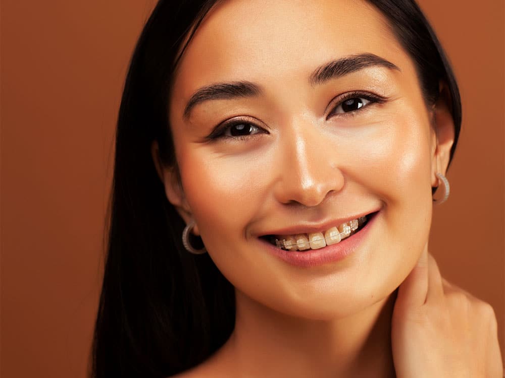 a woman smiling and posing for the camera